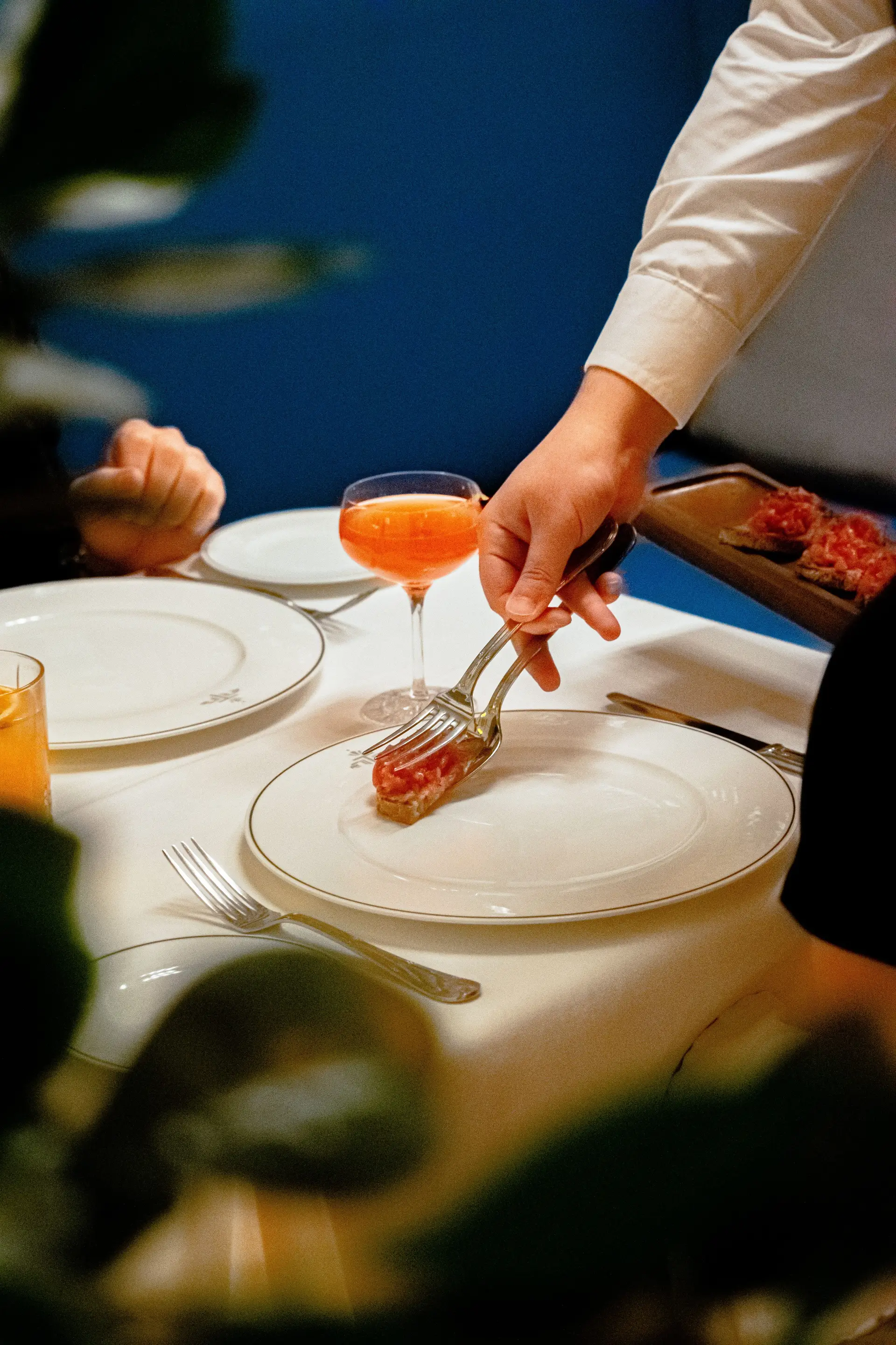Chef preparing a refined course for guests