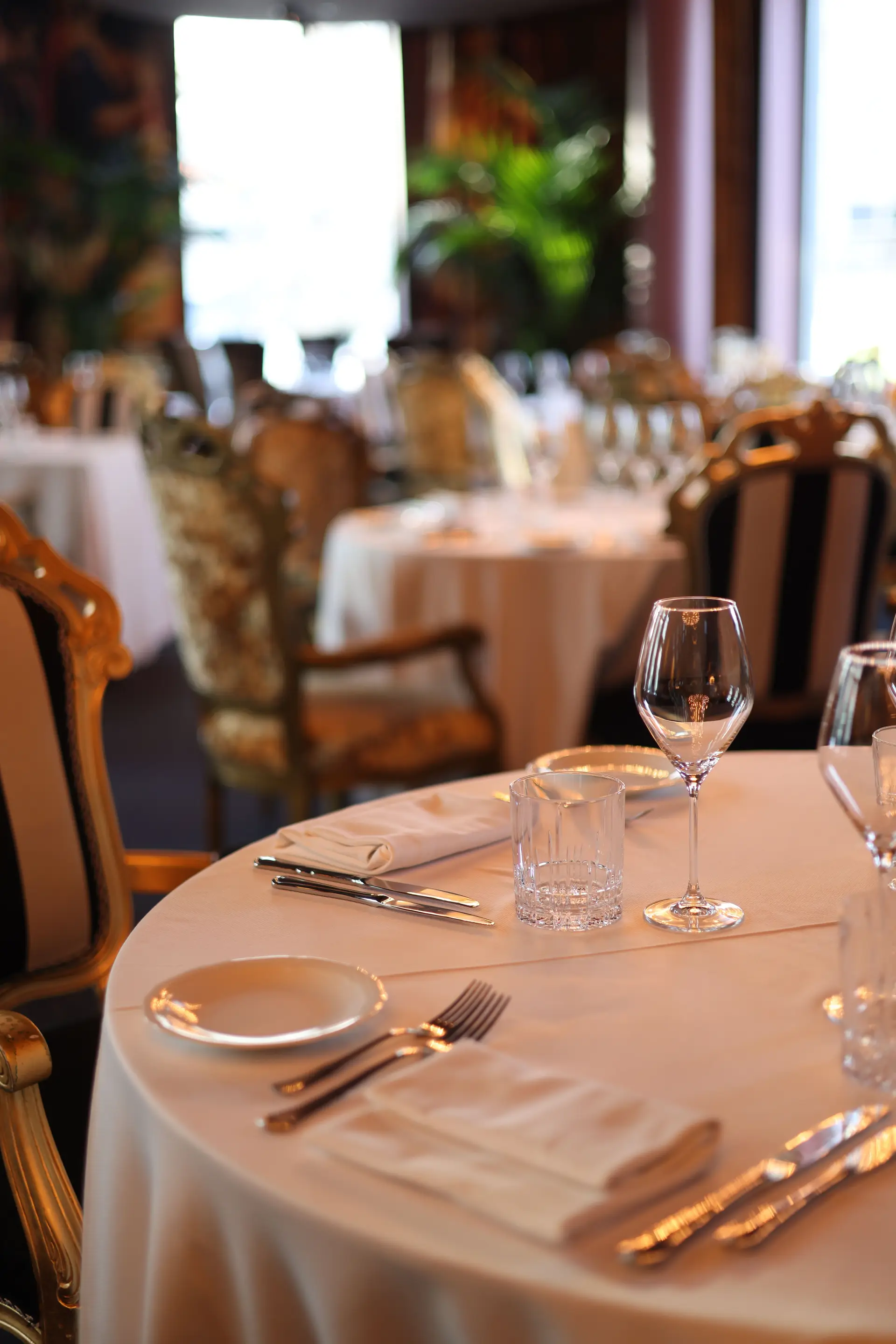 Private dining tables set for a formal gathering